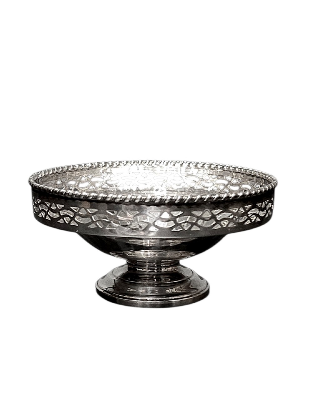 A circular sterling silver pedestal bonbon dish featuring a pierced lattice border, beaded rim, fluted interior, and round stepped foot. View II