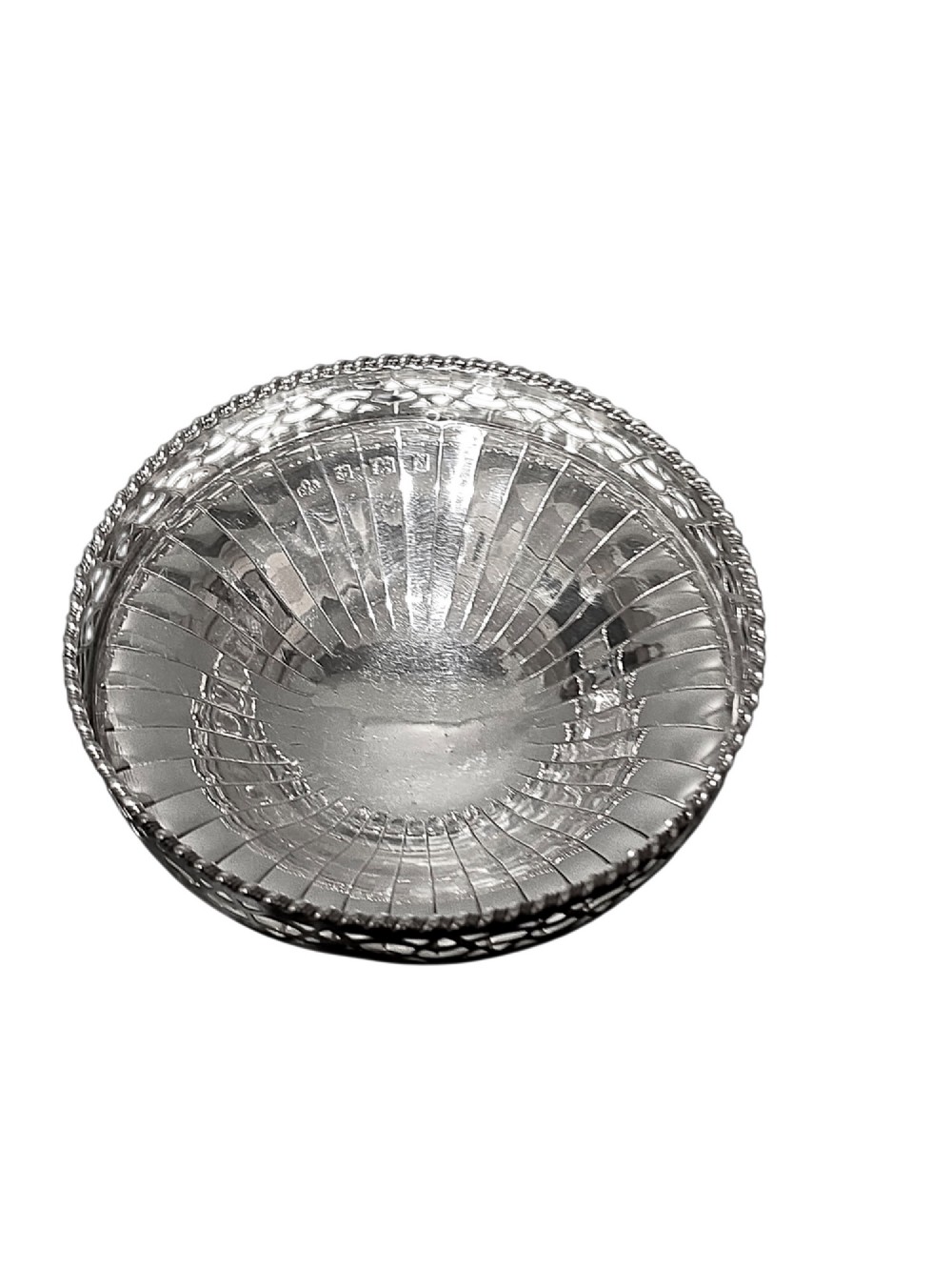 A circular sterling silver pedestal bonbon dish featuring a pierced lattice border, beaded rim, fluted interior, and round stepped foot. View IV