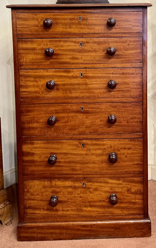 An Early 19th Century Solid Mahogany Tall Chest of Drawers by Heal & Son