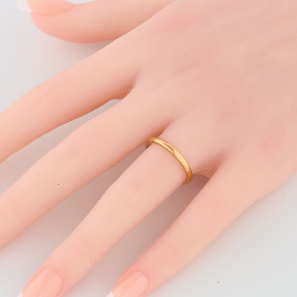 A plain 22ct yellow gold wedding band displaying a polished surface and classic rounded profile. View II