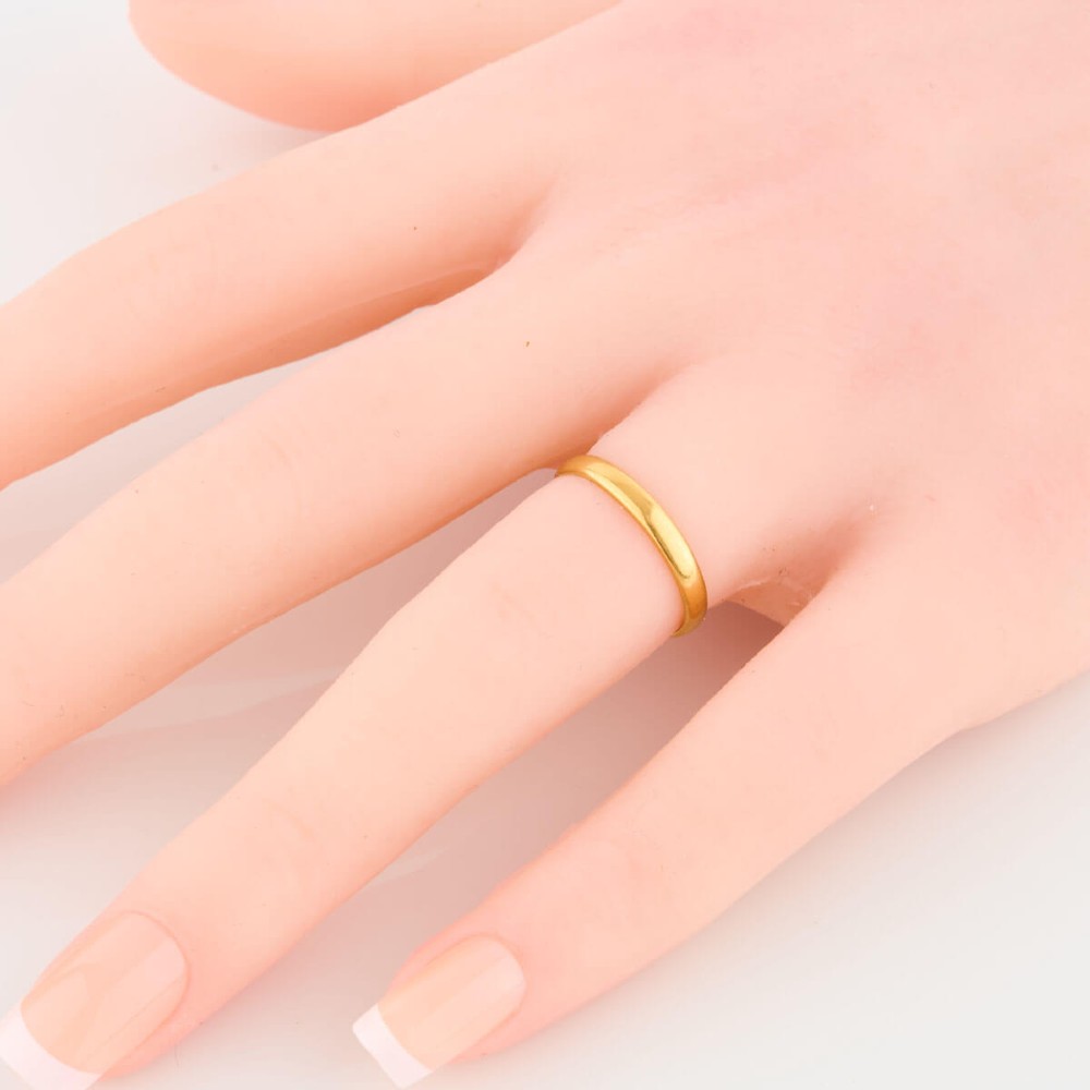 A plain 22ct yellow gold wedding band displaying interior hallmarks. View II
