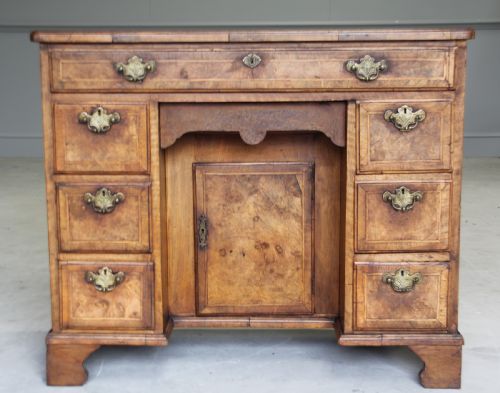 An 18th Century Burr Walnut Kneehole Desk.