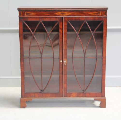 fig 1. A 19th century mahogany display cabinet.