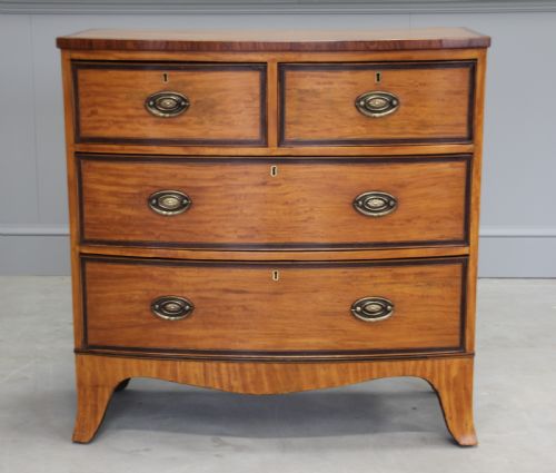 fig 1. An 18th century satinwood chest of drawers.