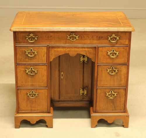 An Early 18th Century Walnut Kneehole Desk.