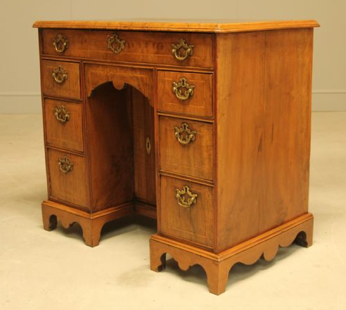 fig 2. An early 18th century walnut kneehole desk.
