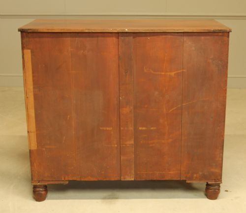 fig 1. A 19th century flame mahogany chest of drawers.