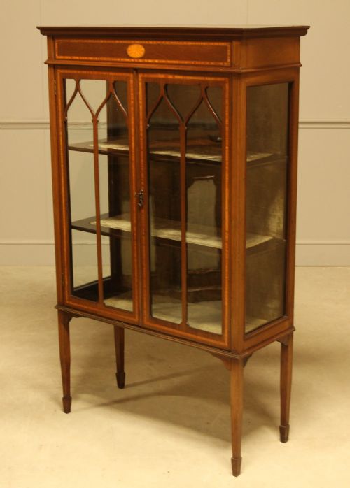fig 2. AN EDWARDIAN MAHOGANY DISPLAY CABINET
