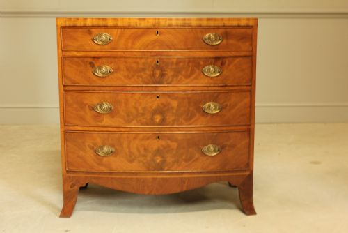 fig 1. A 19TH CENTURY BOW FRONTED CHEST OF DRAWERS