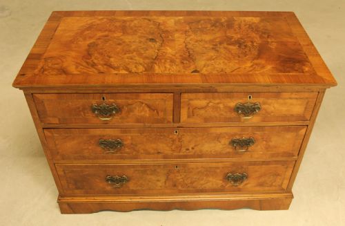 fig 2. A BURR WALNUT CHEST OF DRAWERS