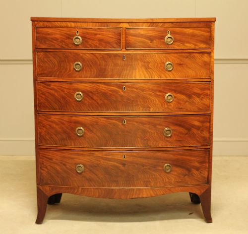 fig 1. A 19th century bow fronted chest of drawers