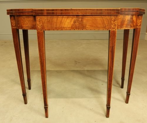 fig 2. A Sheraton period mahogany breakfront card table.