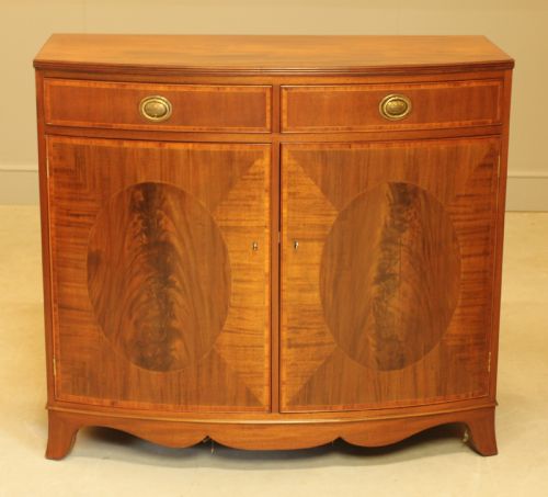 fig 1. A TWO DOOR BOW FRONTED SIDEBOARD