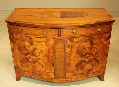 fig 2. AN EDWARDIAN SATINWOOD BOW FRONTED TWO DOOR SIDEBOARD.
