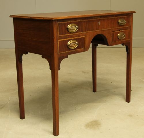 fig 1. A 19th century mahogany kneehole side table.