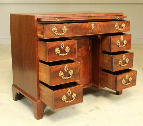 A GEORGE III CURL MAHOGANY KNEEHOLE DESK - ADDITIONAL PHOTO 6