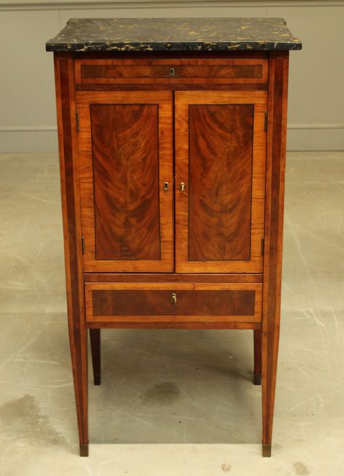 fig 1. A French 19th century marble topped mahogany music cabinet.