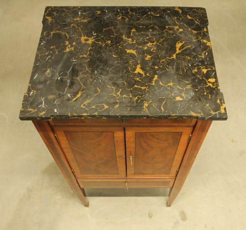 fig 2. A French 19th century marble topped mahogany music cabinet.