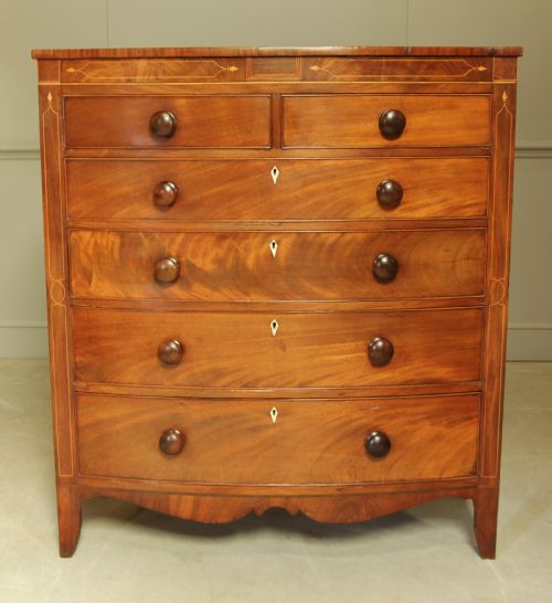 A Victorian Mahogany Bow Fronted Chest of Drawers.