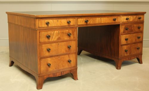 fig 2. AN EARLY 20TH CENTURY CURL MAHOGANY PARTNERS DESK.