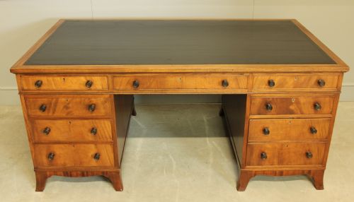 fig 1. AN EARLY 20TH CENTURY CURL MAHOGANY PARTNERS DESK.
