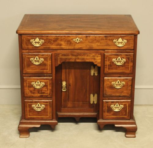 fig 1. A Georgian walnut kneehole desk.