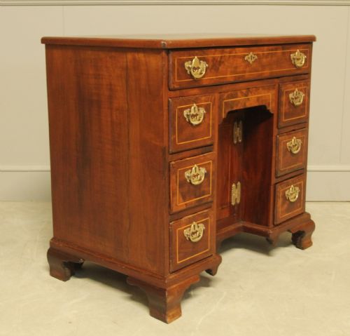 fig 2. A Georgian walnut kneehole desk.