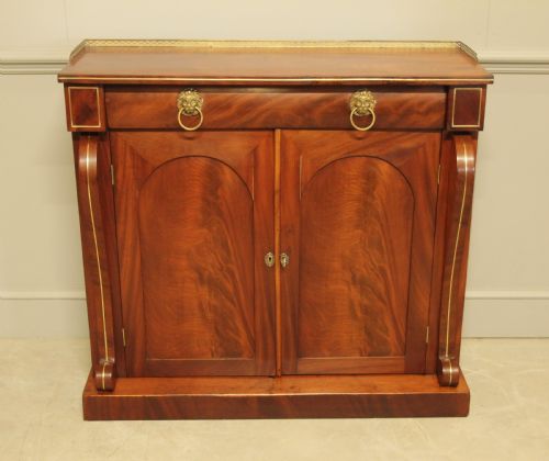 fig 1. A Victorian two door brass inlaid sideboard.