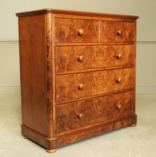 A Victorian Burr Walnut Chest of Drawers.