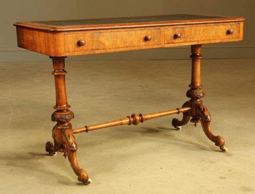 fig 1. A Victorian walnut inlaid writing table.