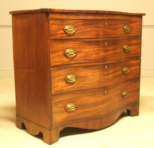 ANTIQUE MAHOGANY SERPENTINE CHEST OF DRAWERS