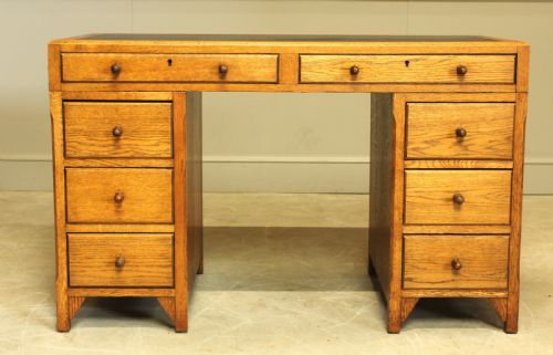 An Early 20th Century Heals Style Oak Twin Pedistal Desk
