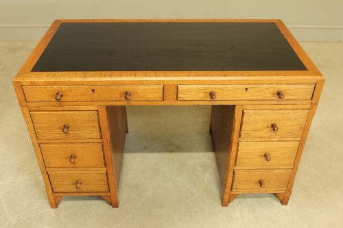 fig 1. AN EARLY 20TH CENTURY HEALS STYLE OAK TWIN PEDISTAL DESK