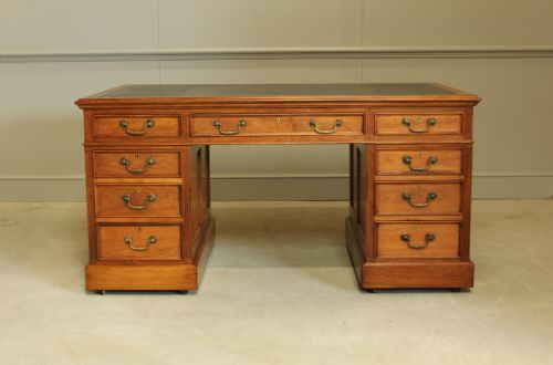 An Early 20th Century Walnut Twin Pedestal Writing Desk.