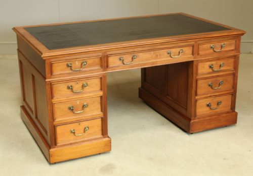 fig 2. An early 20th century walnut twin pedestal writing desk.
