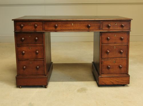 fig 1. A 19th century Victorian oak twin pedestal writing desk.