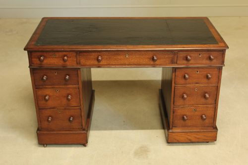 fig 2. A 19th century Victorian oak twin pedestal writing desk.