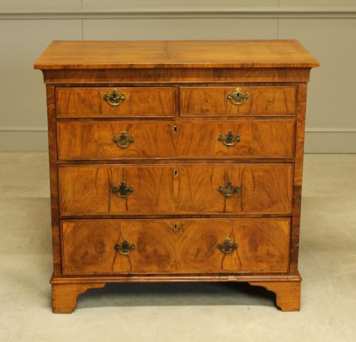 fig 1. A 19th century Walnut chest of drawers.