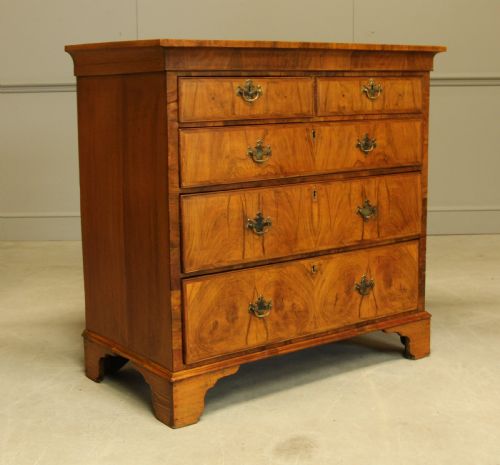 fig 2. A 19th century Walnut chest of drawers.