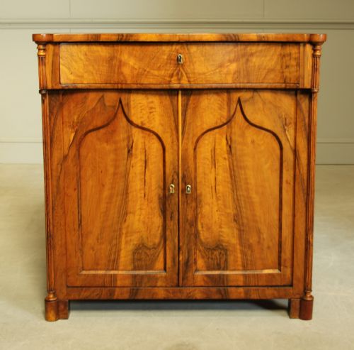 A Serpentine 19th Century French Walnut Two Door Sideboard.