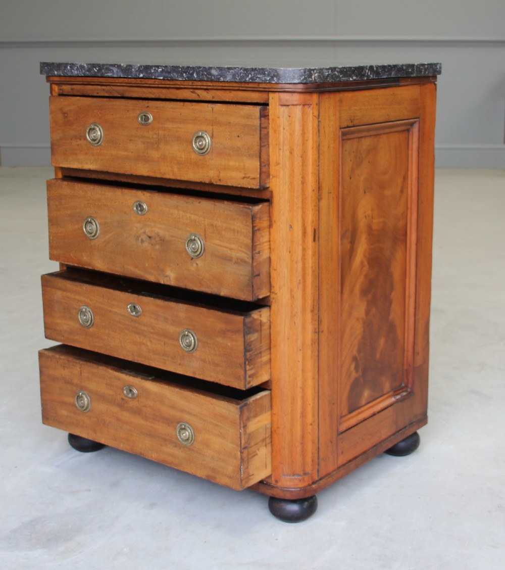 A 19th century French mahogany chest of drawers. View IX