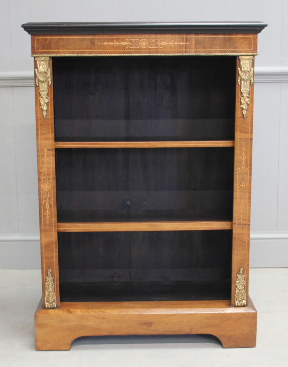 A 19th century walnut open bookcase.
