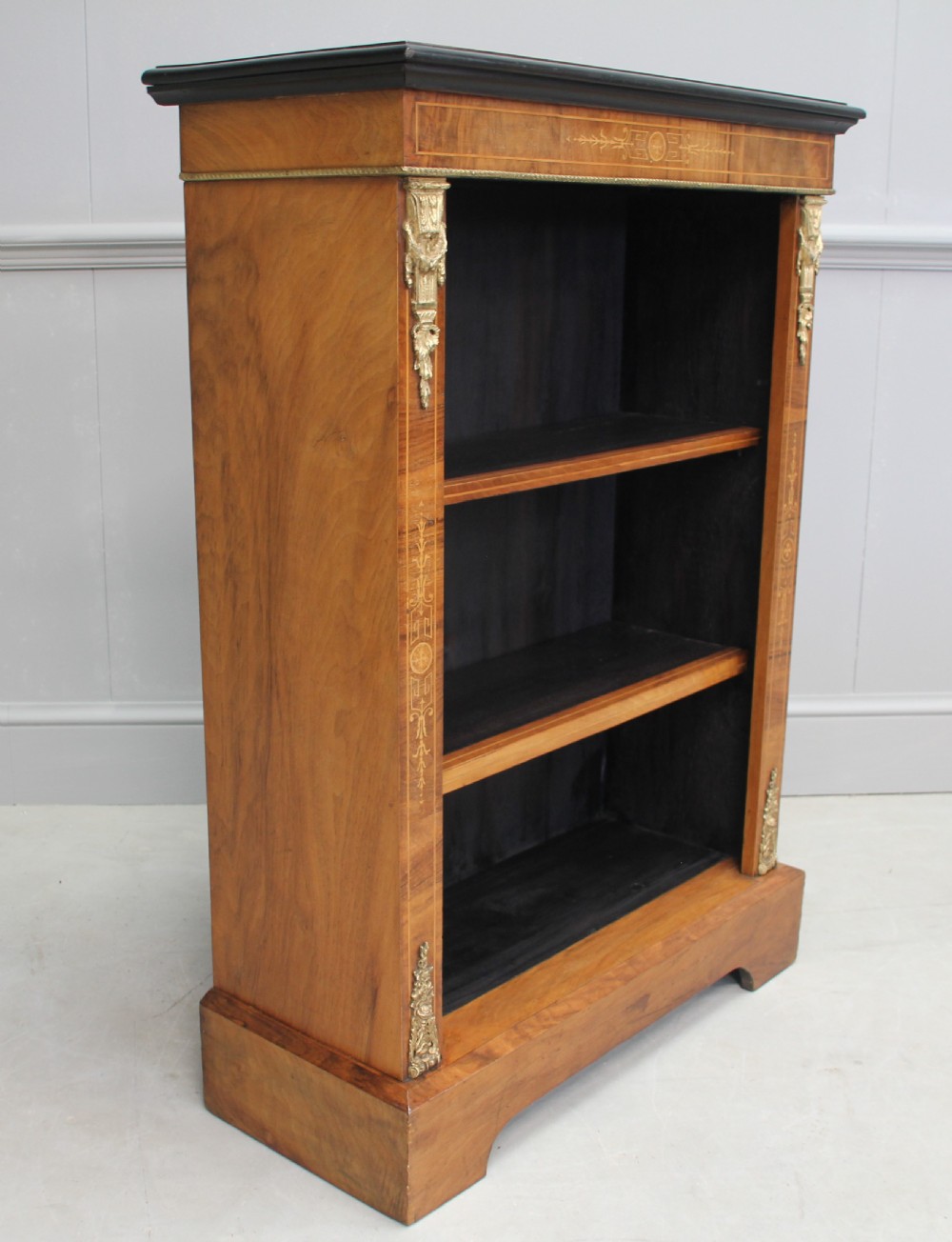 A 19th century walnut open bookcase. View III