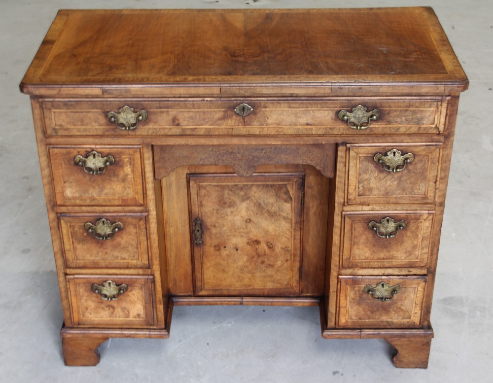 An 18th century burr walnut kneehole desk. View III