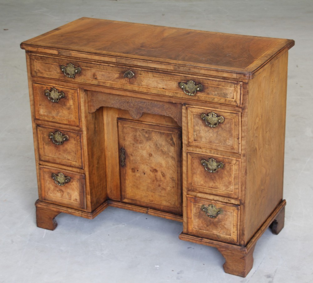An 18th century burr walnut kneehole desk. View IV