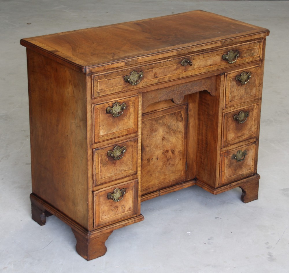 An 18th century burr walnut kneehole desk. View V