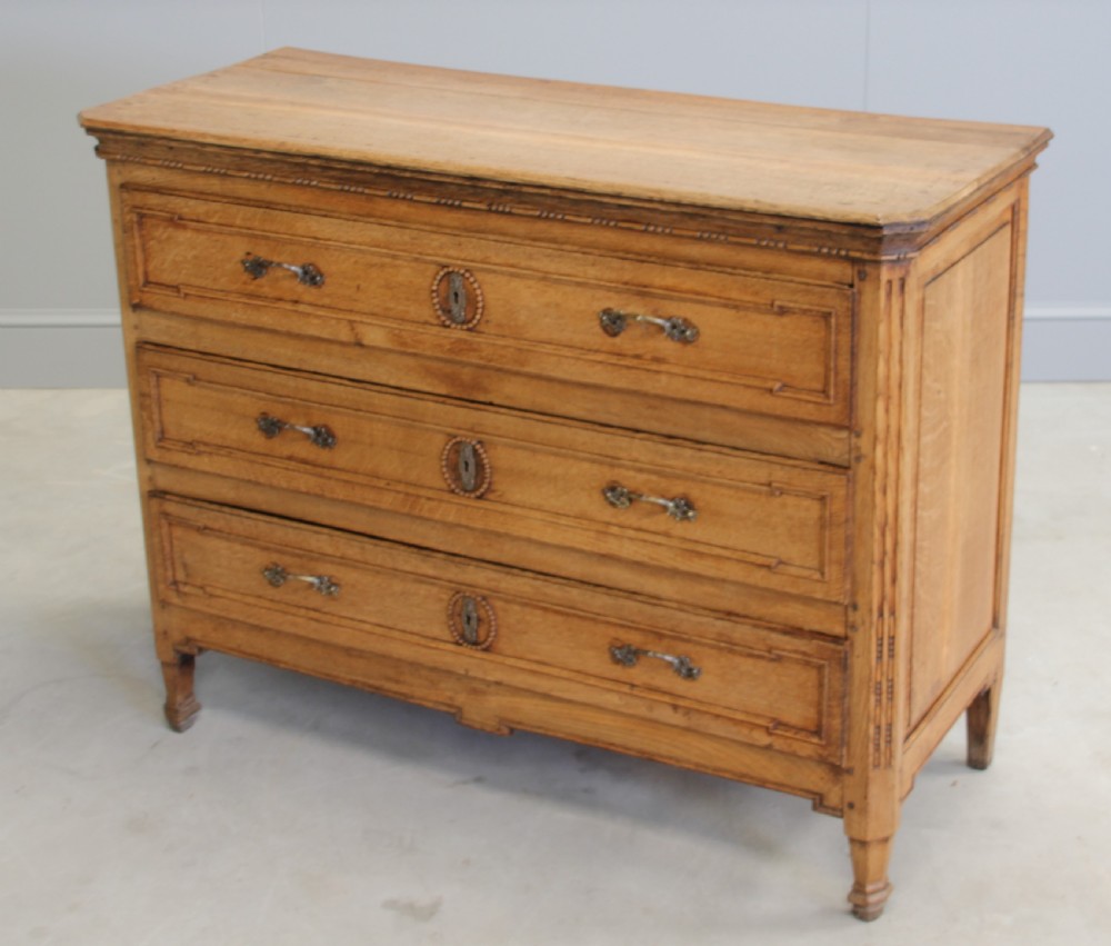 A 19th century French Oak Commode. View III