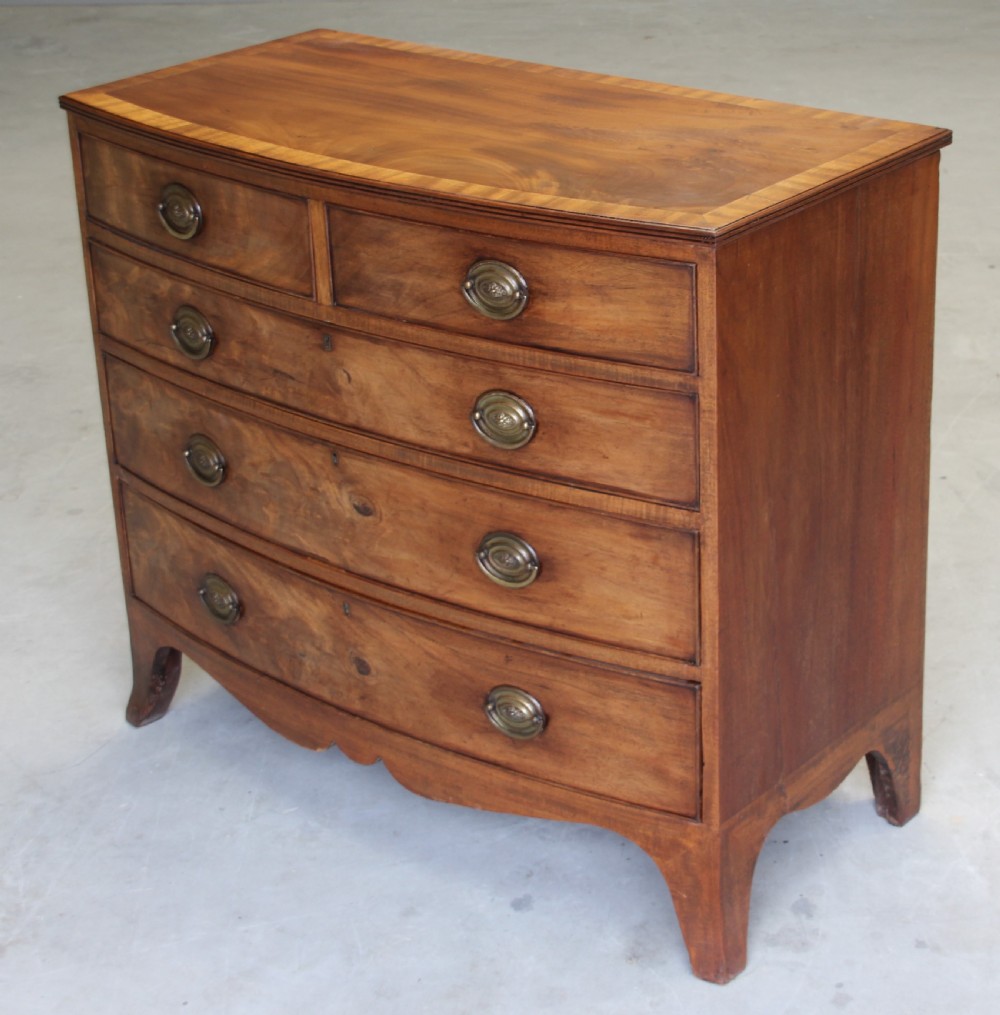 A 19th century mahogany bow fronted chest of drawers. View IV