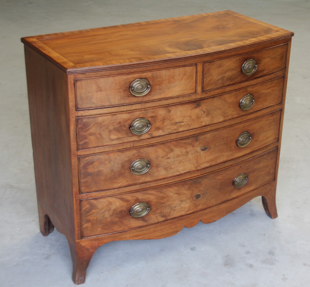 A 19th century mahogany bow fronted chest of drawers. View V