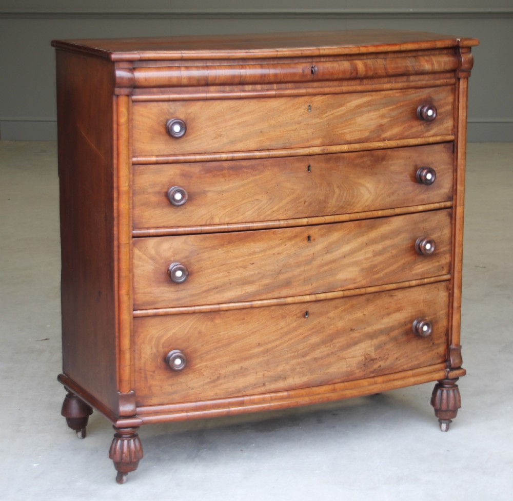 A William IV Mahogany Bow Breakfront chest of drawers View II